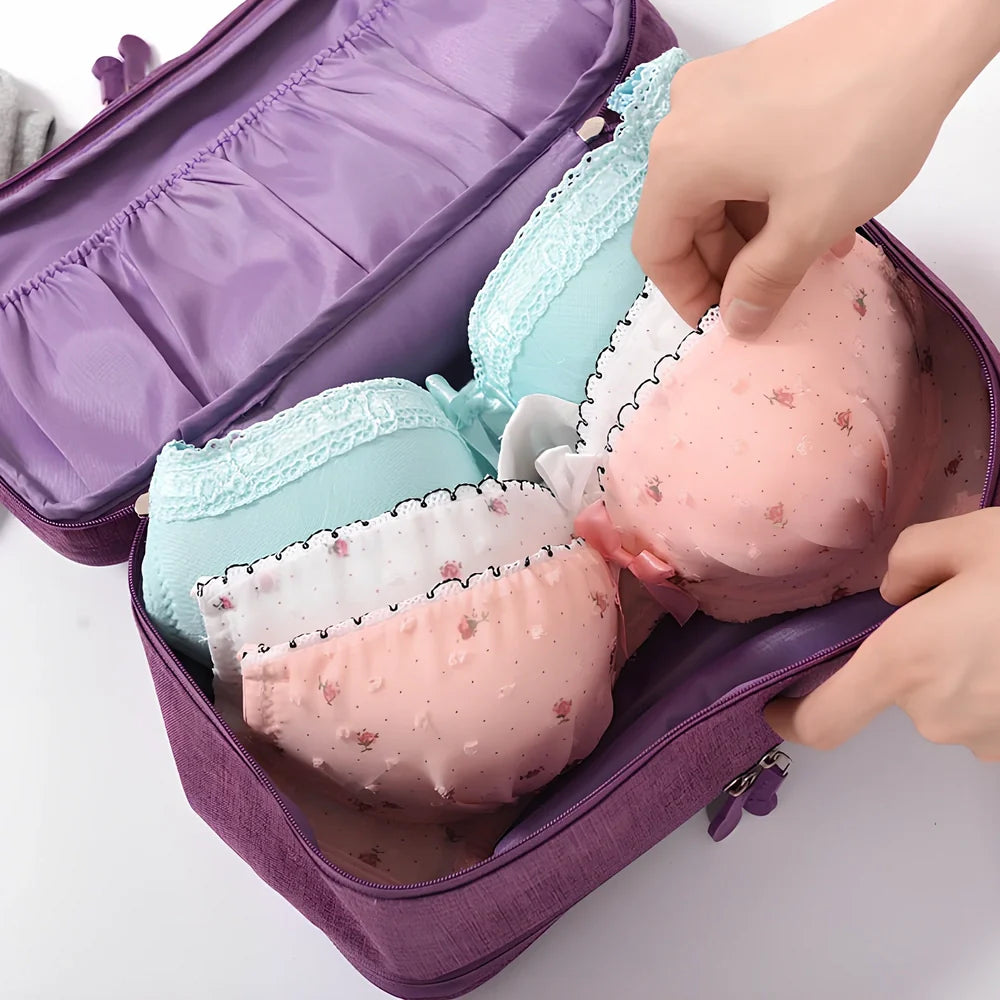 Purple cube-shaped bra storage bag with 3 internal shelves for organising underwear during travel