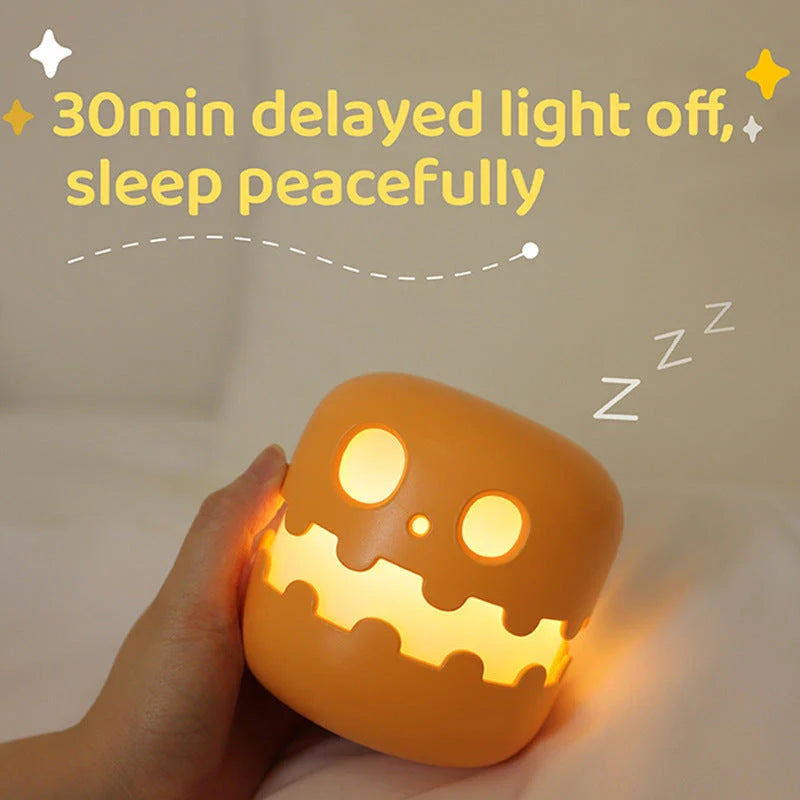 Pumpkin-shaped nightlight with soft silicone construction and warm, soothing glow for creating a cozy Halloween atmosphere