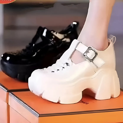 Women's black satin Roman sandals with closed toe, chunky wedge heel, and skull pattern detail on round toe