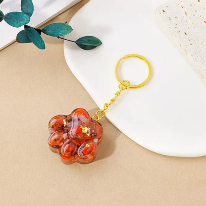Natural crystal cat's paw keychain pendant showing gemstone options with integrated attachment loop