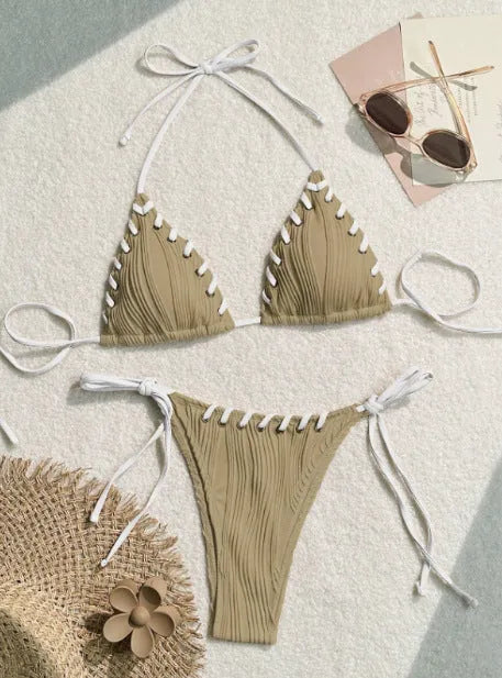 Women's solid colour polyester bikini with eye rope detail, briefs style, sizes S M L