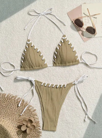 Women's solid colour polyester bikini with eye rope detail, briefs style, sizes S M L