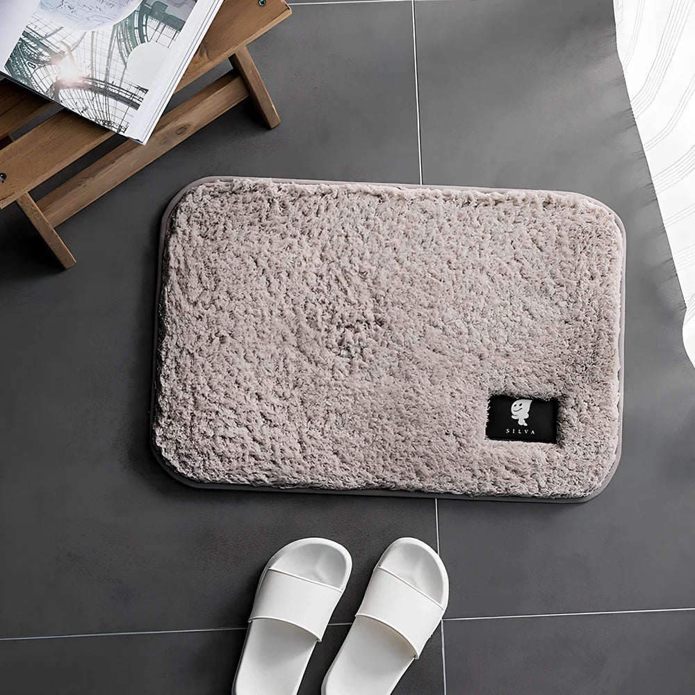 Rectangular polyester anti-slip mat in beige colour for bathroom use with non-woven construction