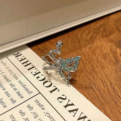 Copper women's ring with Chinese butterfly design and adjustable open loop.