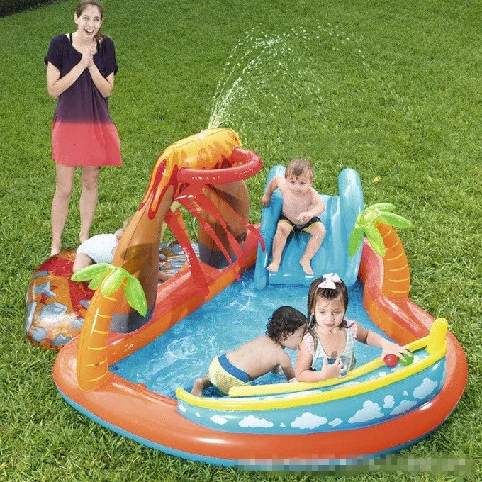 Children playing in an inflatable volcano-shaped pool with sprinkler and toys