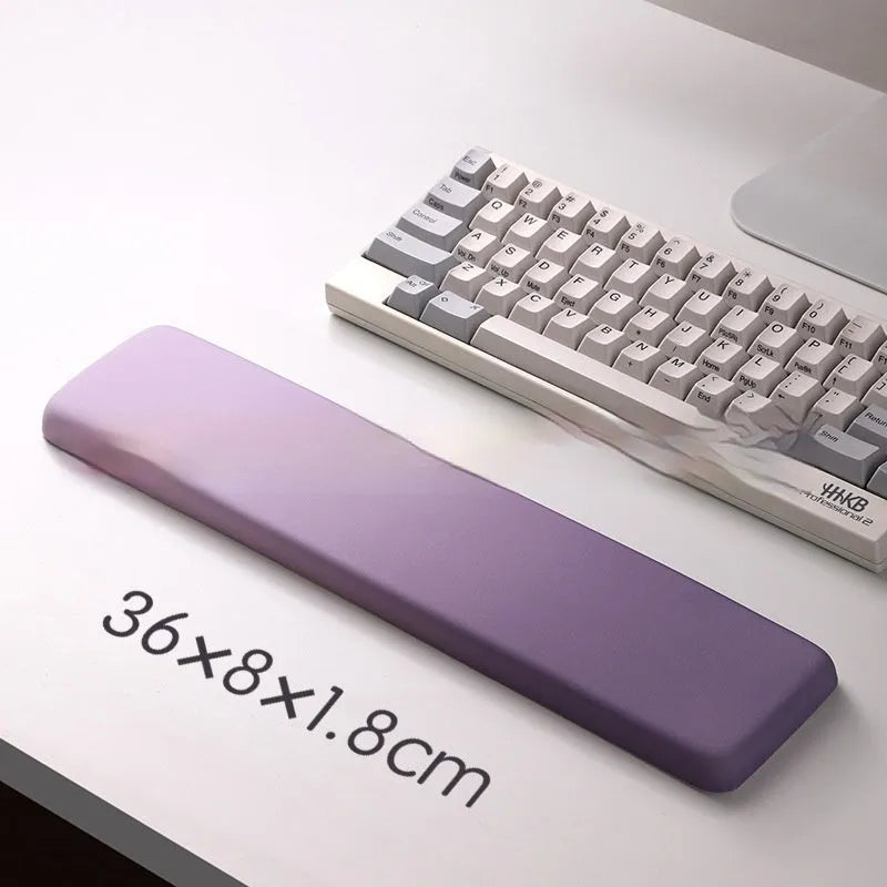 Square cloth mouse pad with grey silicone gel wrist rest and hand pillow on a wooden desk.
