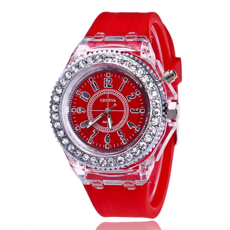 Women's LED luminous quartz watch with silicone strap and round alloy case on wrist