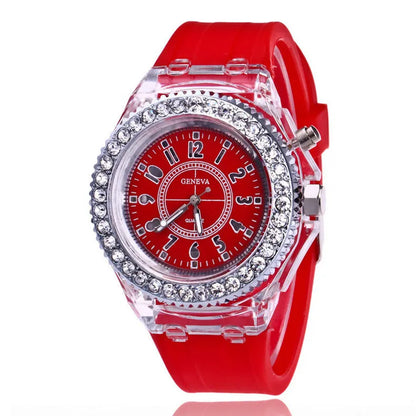 Women's LED luminous quartz watch with silicone strap and round alloy case on wrist