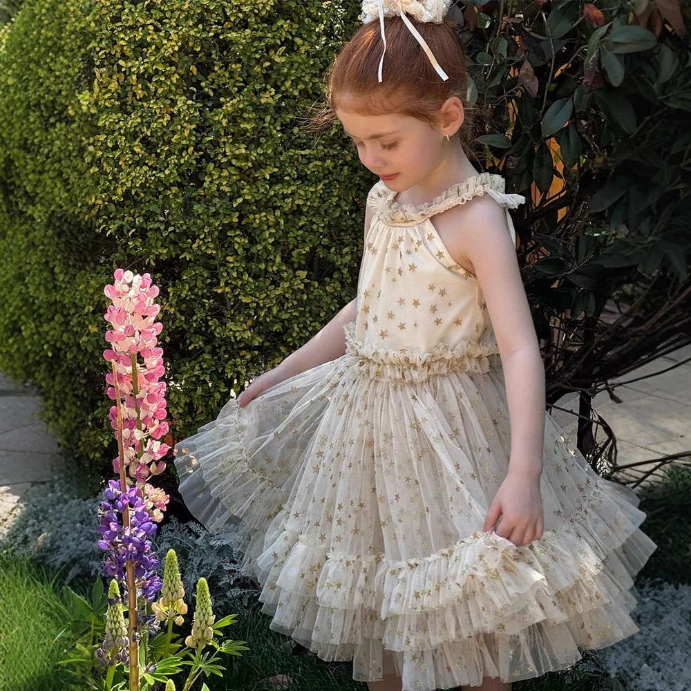 Apricot-coloured girls' halter neck tulle skirt with sleeveless design and floaty appearance