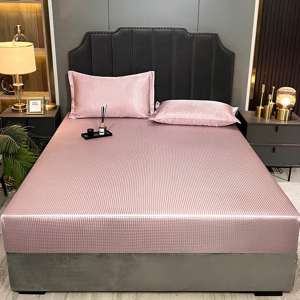 Houndstooth ice silk jacquard fitted three-piece bedding set in ice blue, 180x200cm size with pillowcases on white bed