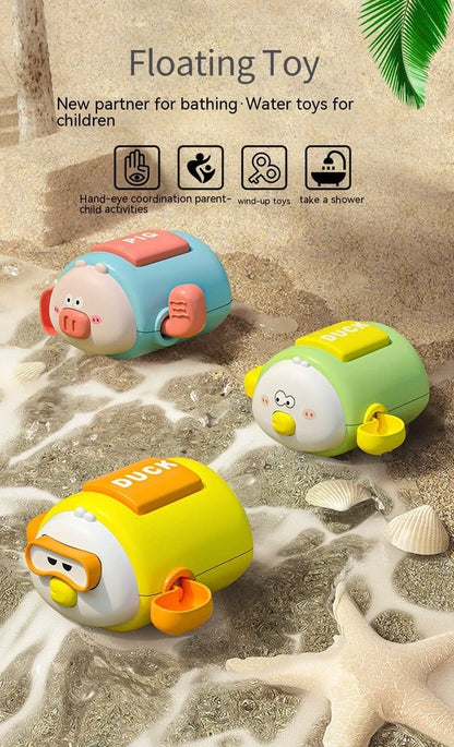 Children's wind-up bath toy measuring 8.2x9.4x5cm with chain attachments in blue pig design