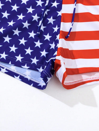 Women's blue and red Stars and Stripes high waist boxer swim shorts with a white drawstring.