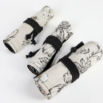 Black peony floral print canvas pencil roll bag open to show 24 or 72 pencil slots.