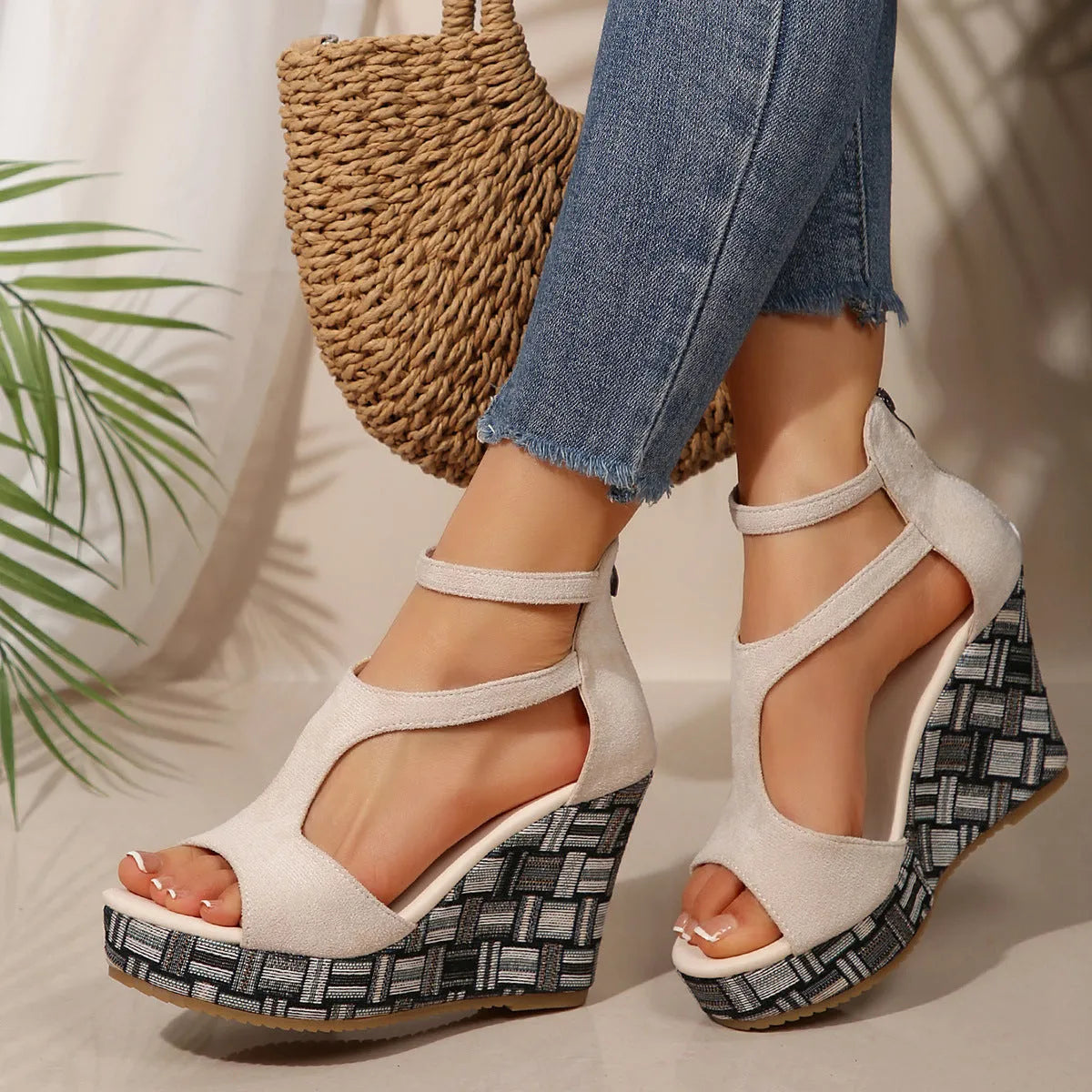 Women's thick-soled ankle-strap buckle sandals in cream white, showing cloth upper and rubber sole.