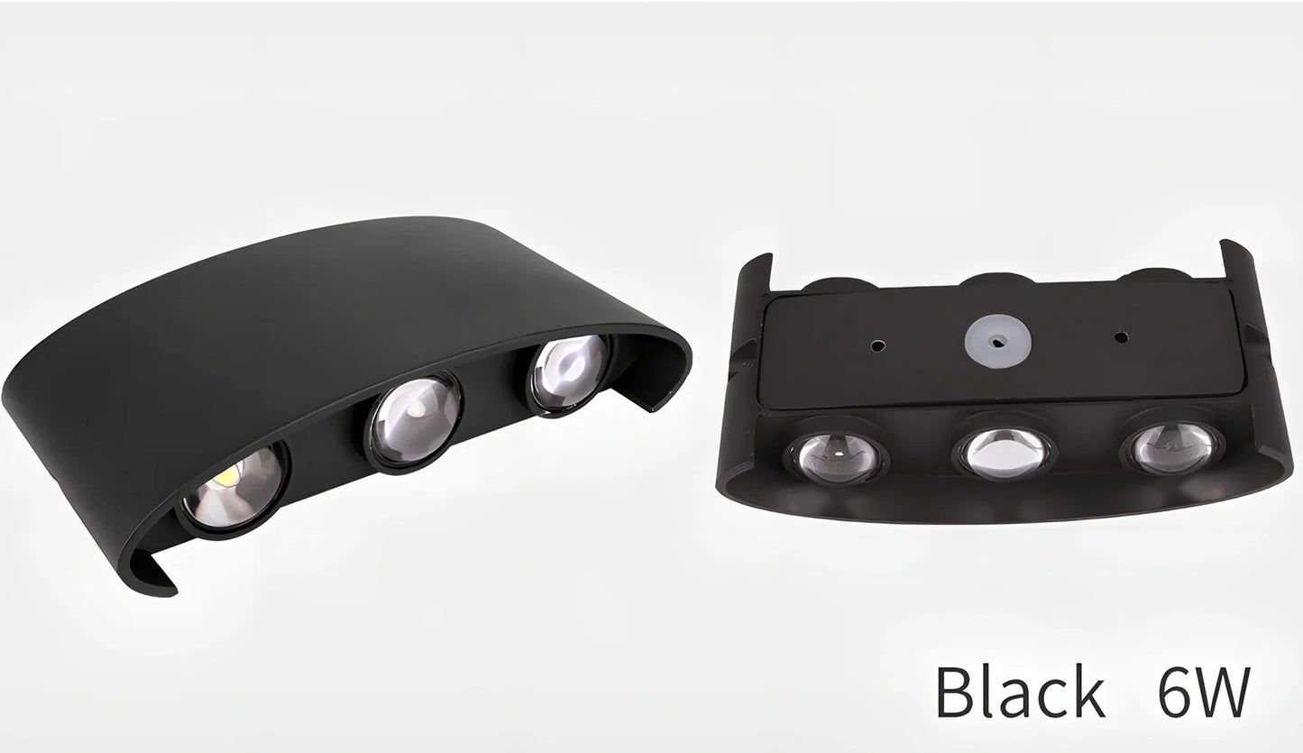 Waterproof black aluminium LED wall lamp 4W warm white emitting 60-degree beam angle mounted on white wall