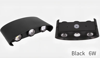 Waterproof black aluminium LED wall lamp 4W warm white emitting 60-degree beam angle mounted on white wall