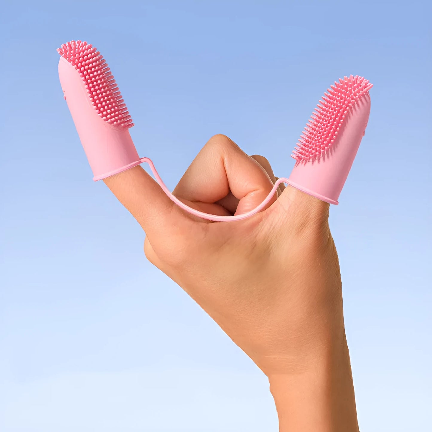 Pet tooth cleaning finger set showing double finger toothbrush covers in pink, blue green, and grass yellow colours.
