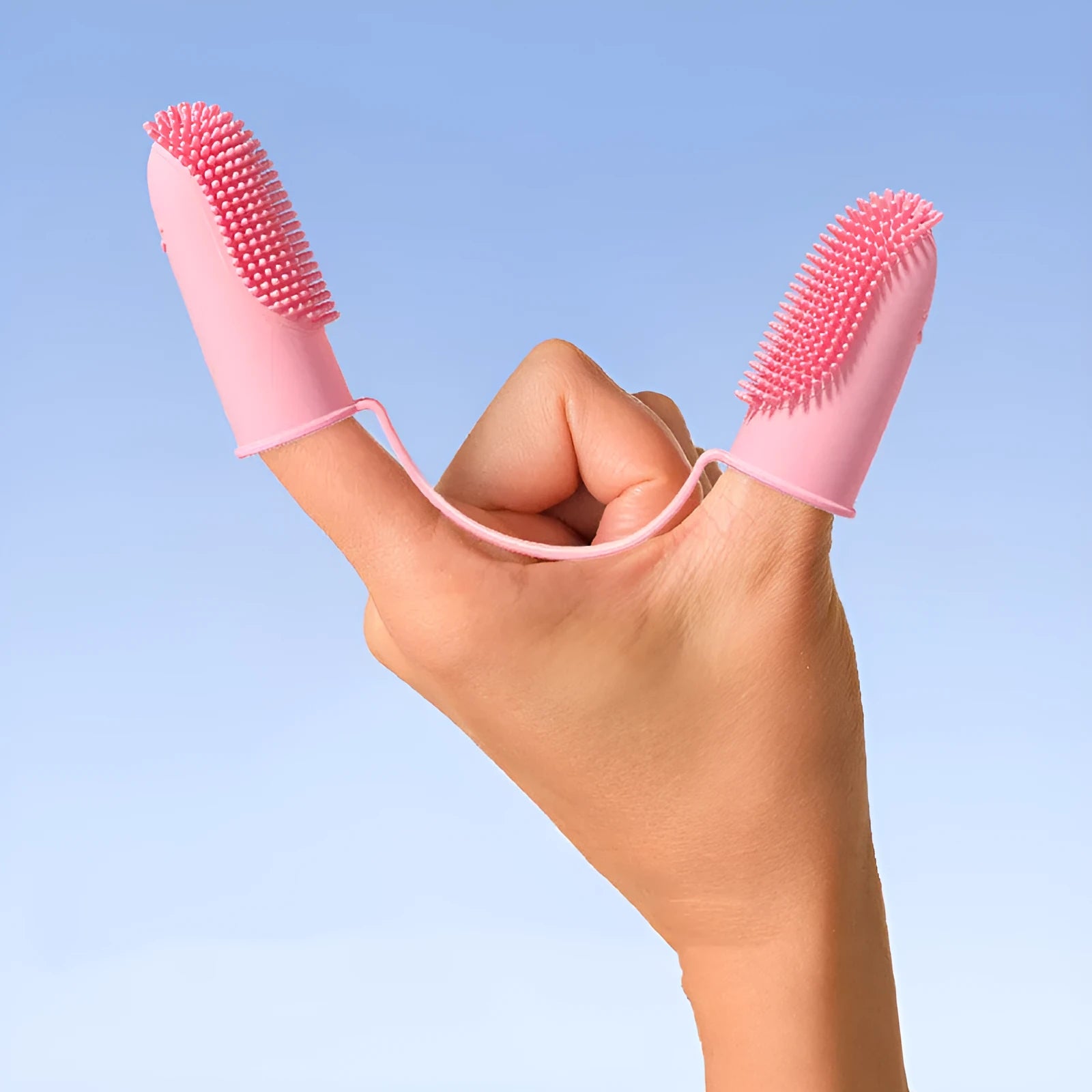 Pet tooth cleaning finger set showing double finger toothbrush covers in pink, blue green, and grass yellow colours.