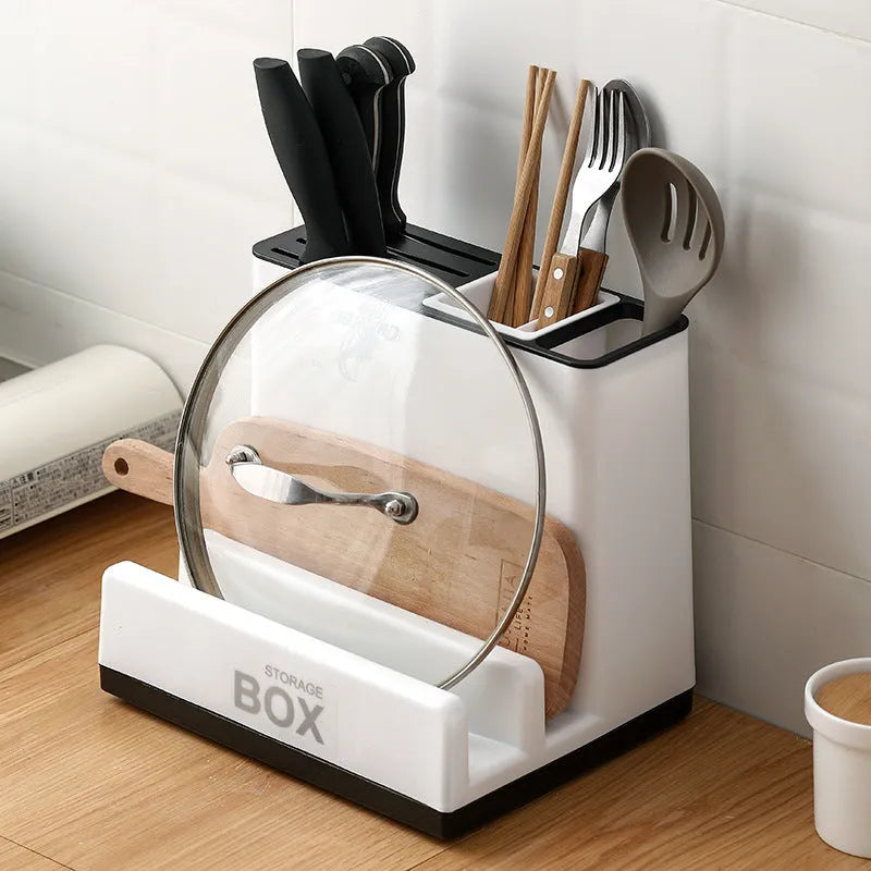White plastic desktop kitchen knife storage rack with integrated shelf and individual partitions.