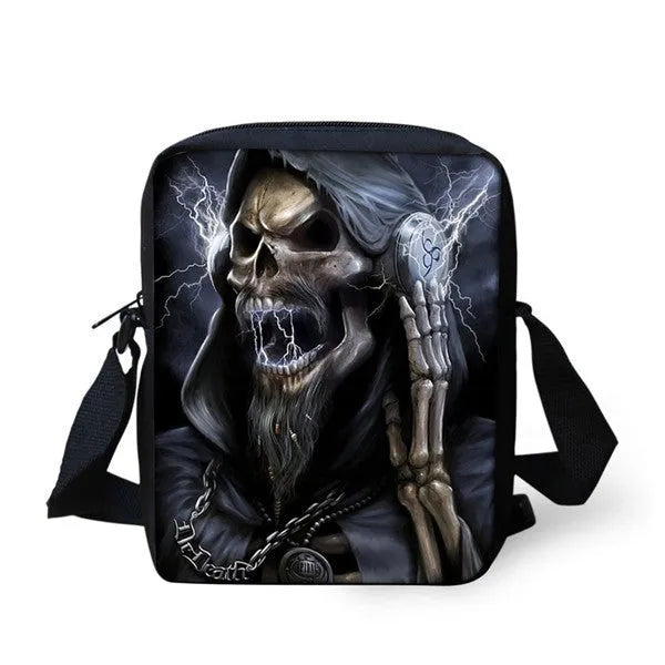 Blue skull print children's messenger bag with two black adjustable shoulder straps, shown open.