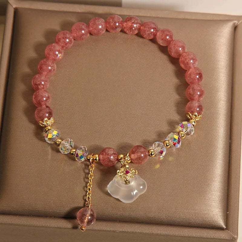 Women's adjustable crystal bracelet with strawberry quartz, white agate beads, and auspicious cloud charms