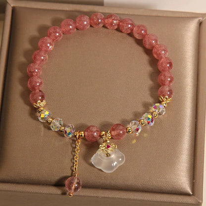 Women's adjustable crystal bracelet with strawberry quartz, white agate beads, and auspicious cloud charms
