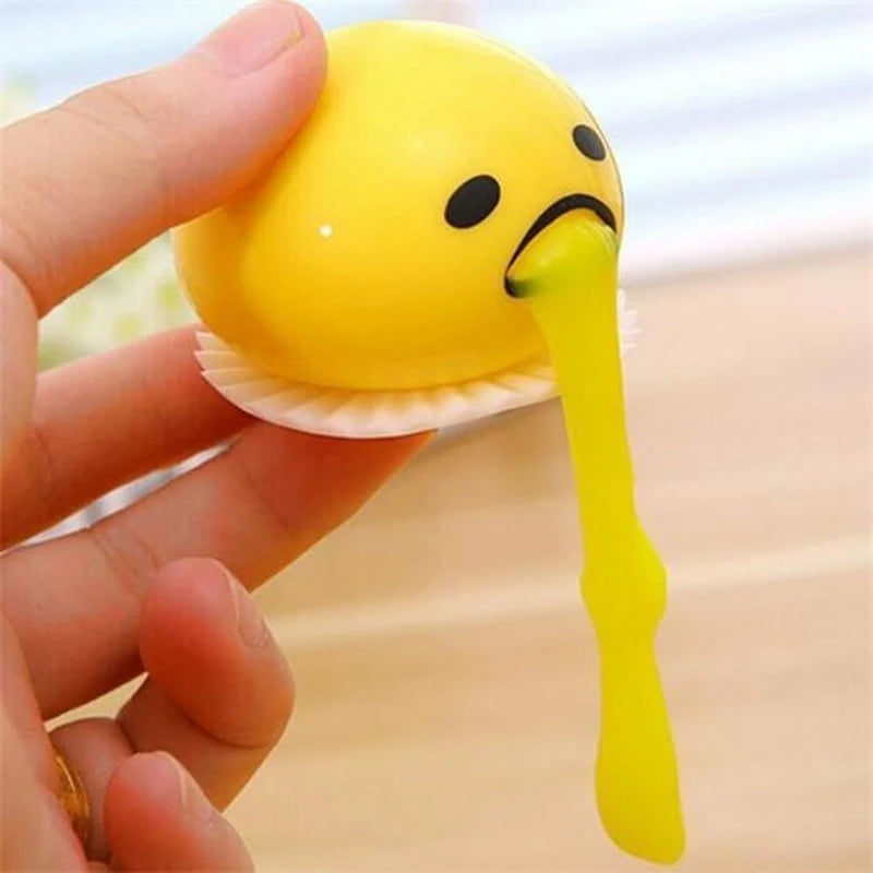 Gudetama Vomiting Egg Toy in green, orange, pink, and yellow for stress relief and fun
