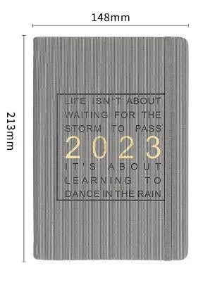 Creative student almanac diary with imitation leather cover open on a calendar page.