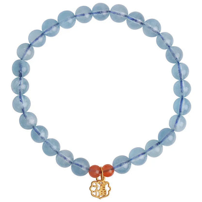 Ice translucent aquamarine crystal bracelet with 8mm round beads and sequin details on a wrist.