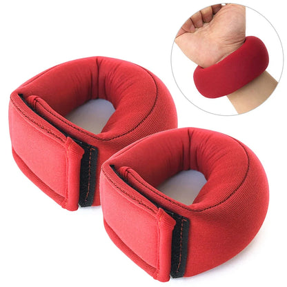 Red neoprene weight-bearing sandbags with reinforced stitching for strength training