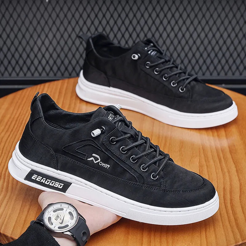 Grey men's low-top canvas casual trainers with lace-up front and round toe