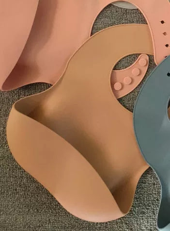 Soft waterproof silicone baby bib with food catcher in various colors