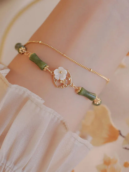 Natural olivine double layer bracelet with olive branch charms on wrist