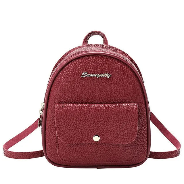 Small women's shoulder backpack in solid colour with zipper closure, dimensions 18.5cm x 8cm x 21cm