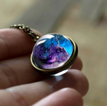 Mesmerizing double-sided galaxy pendant necklace in various celestial patterns and colors