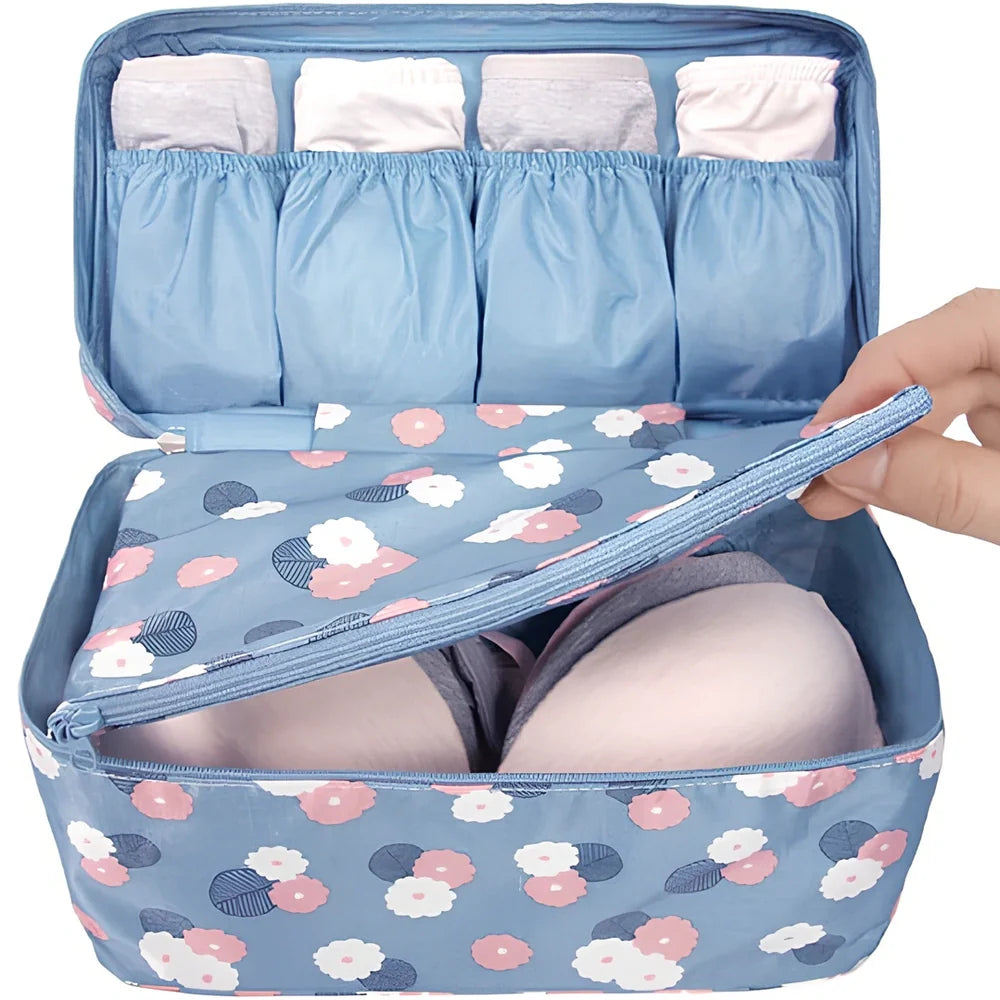 Compact travel underwear organizer in navy blue, 28cm x 14cm x 14.5cm with mesh pockets for packing