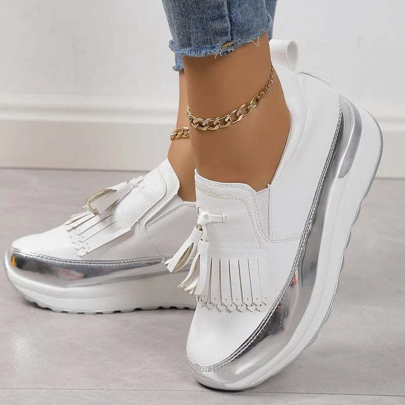 Women's black platform casual shoes with tassel detail and muffin wedge heel