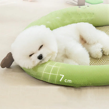 Green fruit-shaped backrest pet cooling mat for a dog, showing nest design and size scale.