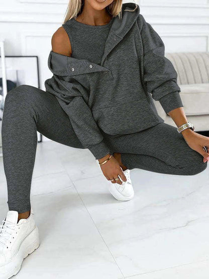 Women's 3-piece sports suit featuring a hooded sweatshirt with pockets and slim trousers