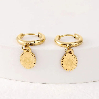 Geometric stainless steel earrings with ellipse design and ear button fastening, approximately 2-3cm diameter
