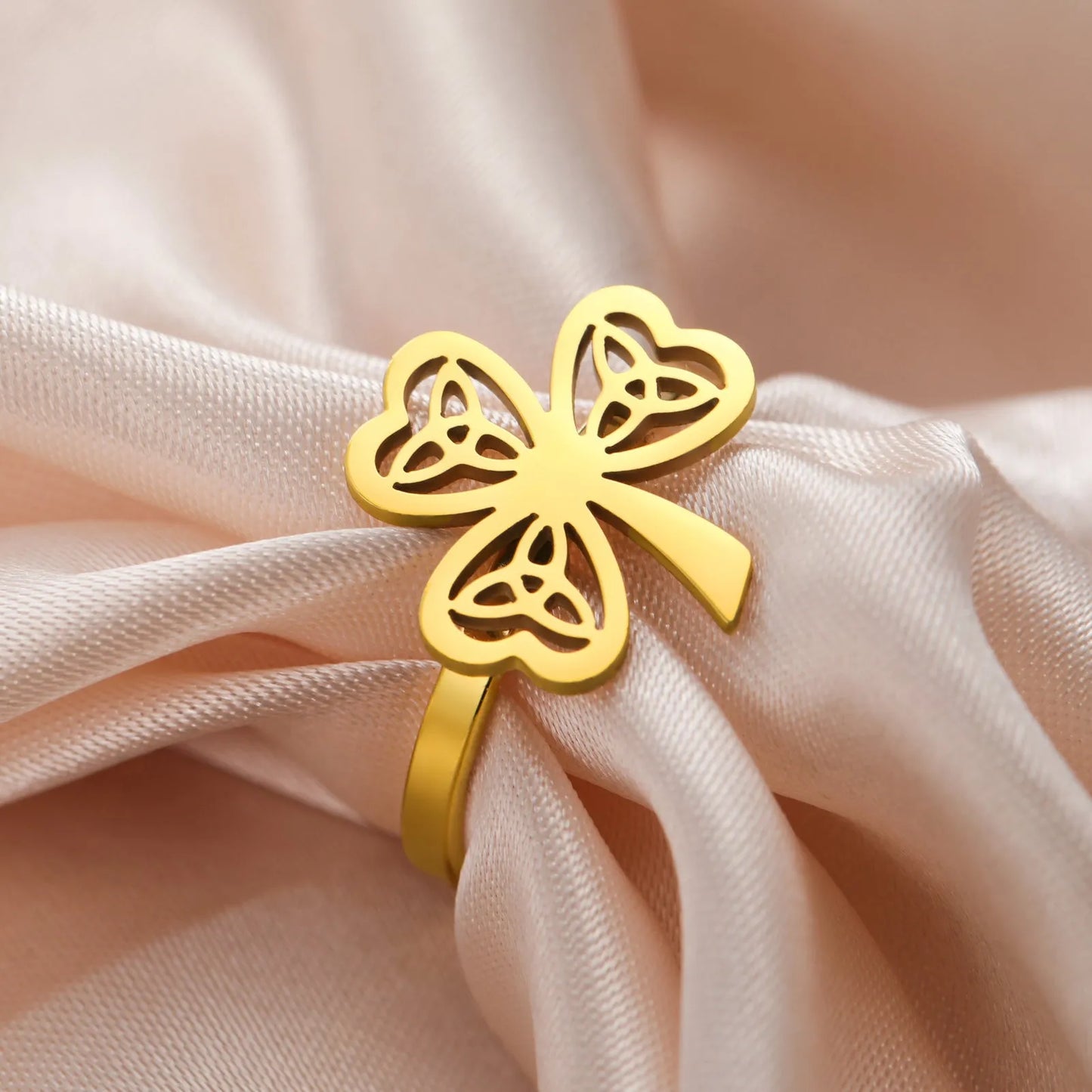 Stainless steel lucky ring with hollow band in gold or steel colour finish.