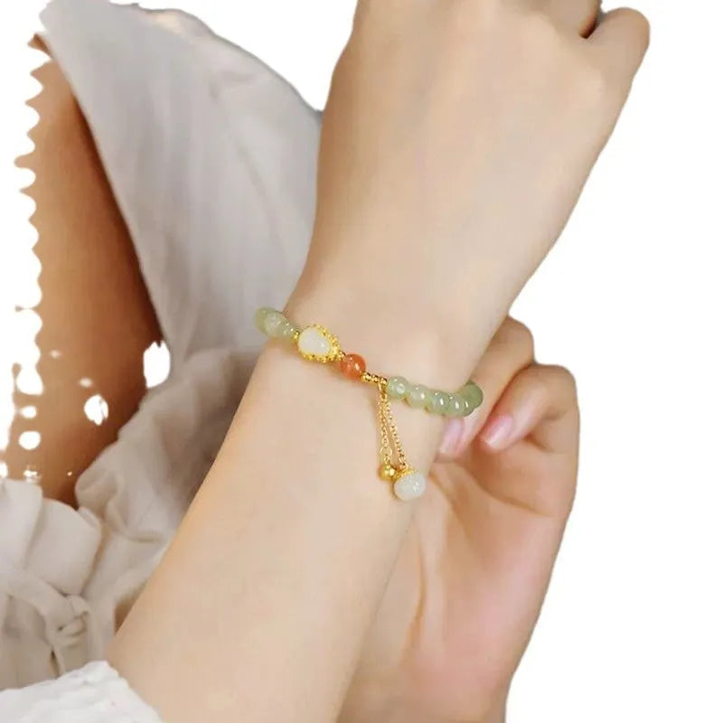 Qingshui jade women's bracelet with gold gourd charm and fu character on 6mm beads