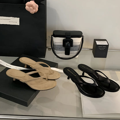 Women's open-toed stiletto sandals in rubber construction showing round toe design