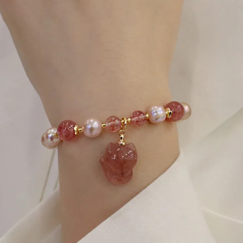 Women's light pink freshwater pearl bracelet with fox charm and zodiac animal design
