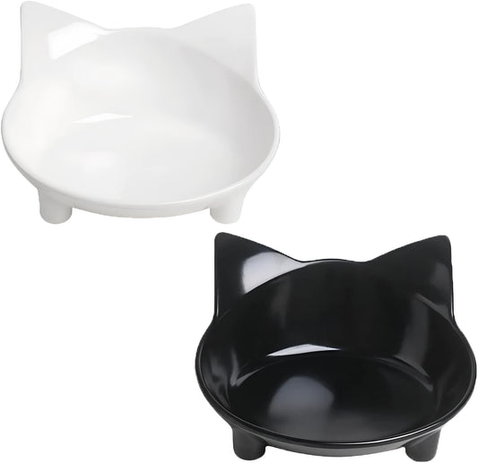 Black shallow melamine pet bowl with non-slip rubber base on a kitchen floor