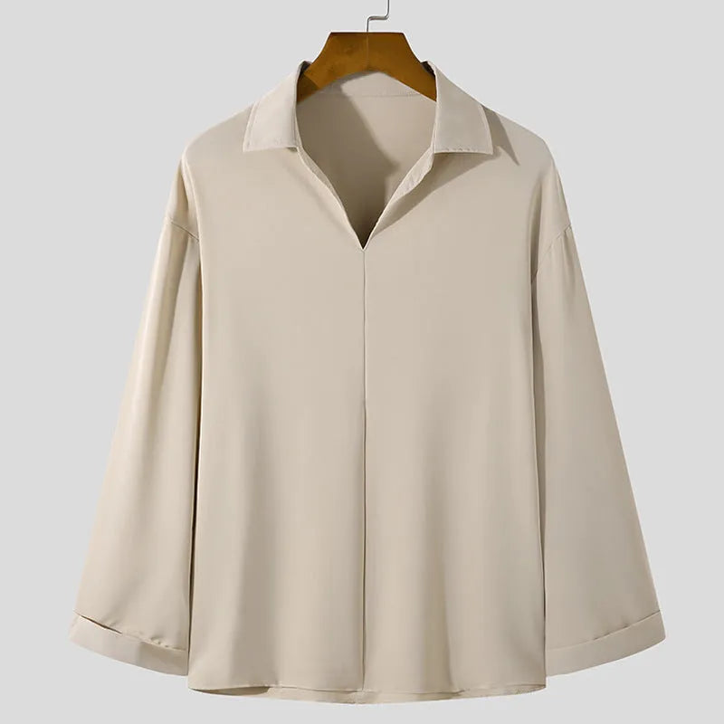 Loose lapels casual shirt for men in slim business style with long sleeves and non-iron process, available in white, black, skin colour, blue, and sizes S, M, L, XL, 2XL, 3XL, made from polyester fibre blend fabric.