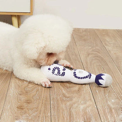 Red and white plush dog toy shaped like a tequila bottle with squeaker