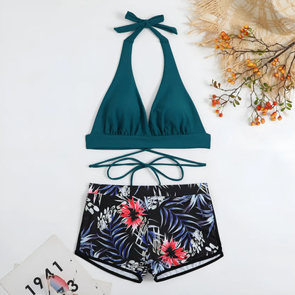 High waist split bikini in peacock green, red, or black, nylon outer with polyester lining, sizes S to XL