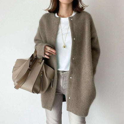 A cozy, knitted cardigan jacket in a variety of colors and sizes, featuring a relaxed open-front silhouette and premium construction for versatile layering.