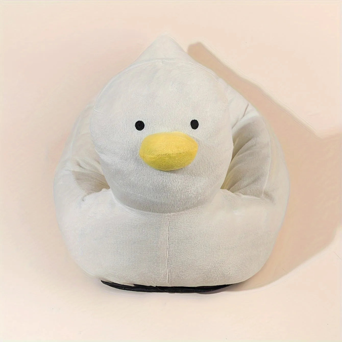 Blue duck shape fluffy pet bed sofa for small dogs and cats on a wooden floor